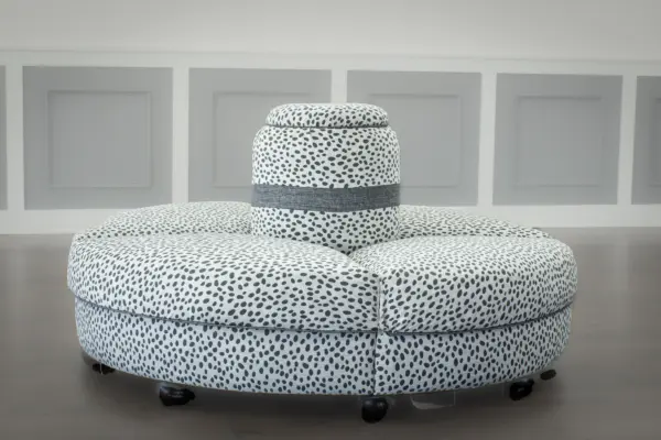 Reupholstered round banquette sofa by Sullivan Mercantile.