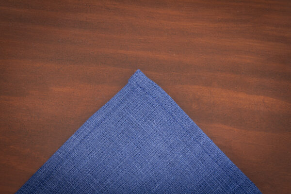 Corner of linen napkin to show stitching in French Blue by Sullivan Mercantile