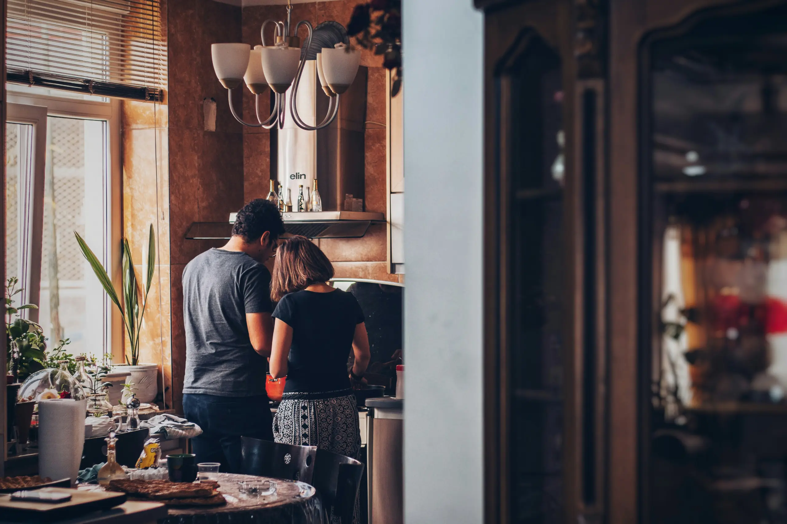 Couple in kitchen of home